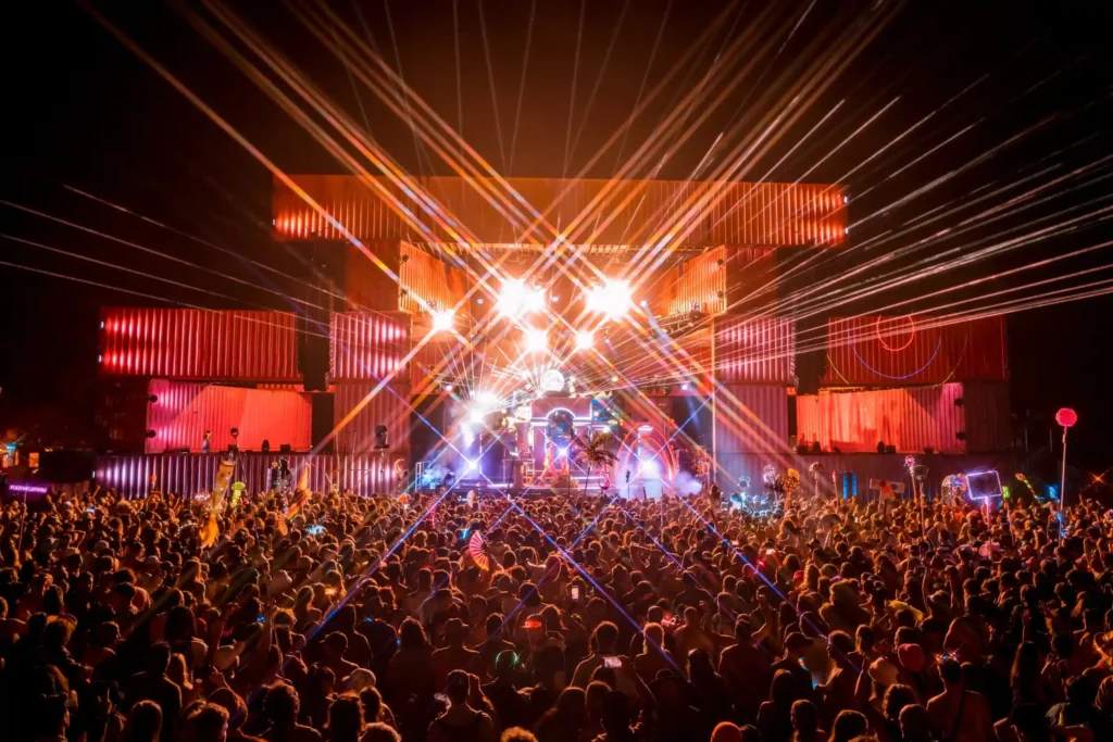 Lightning in a Bottle Festival The main stage at Lightning in a Bottle festival lit up with lasers and a massive crowd dancing at night